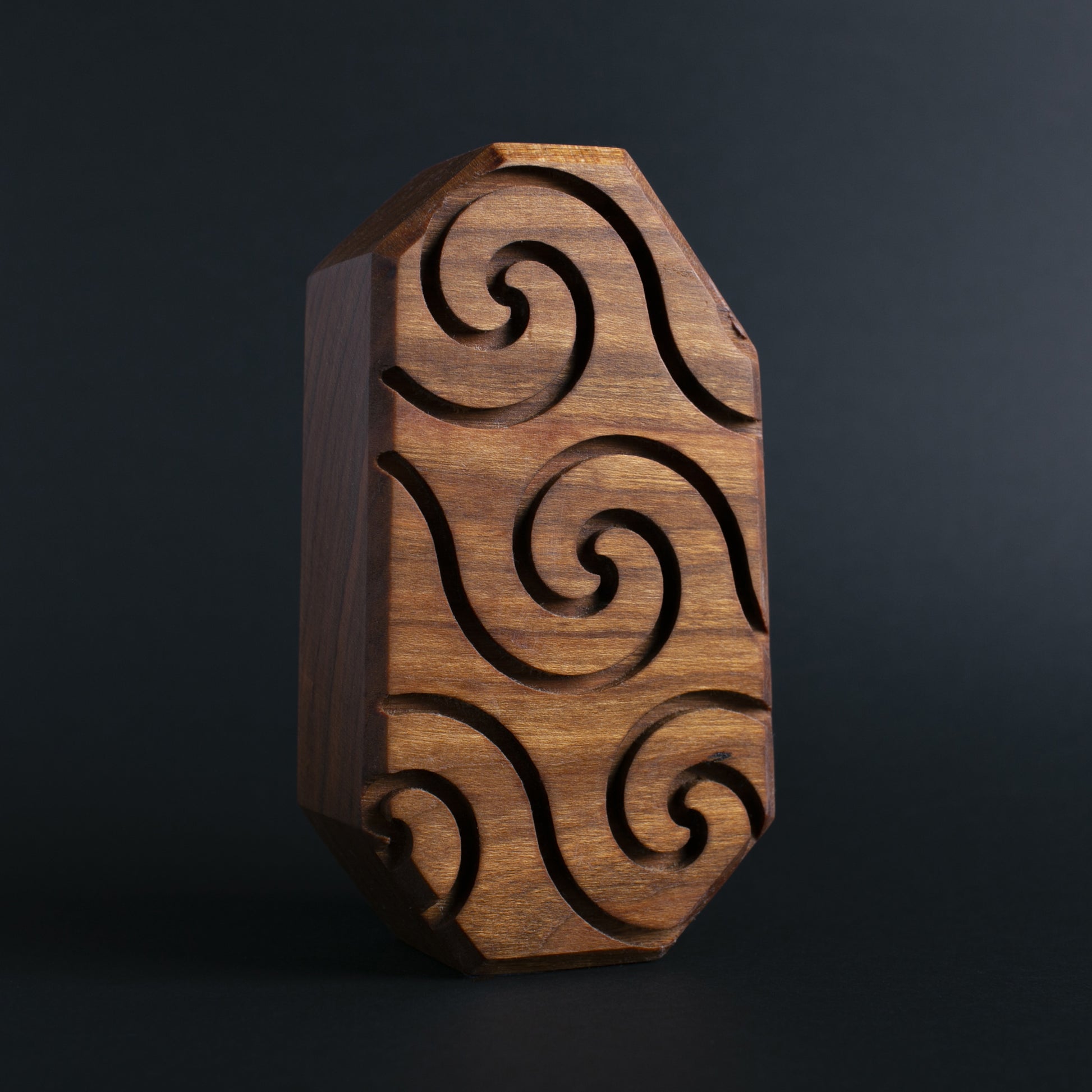 Handcrafted wooden talisman of Blizznek emitting a protective glow for bedtime safety