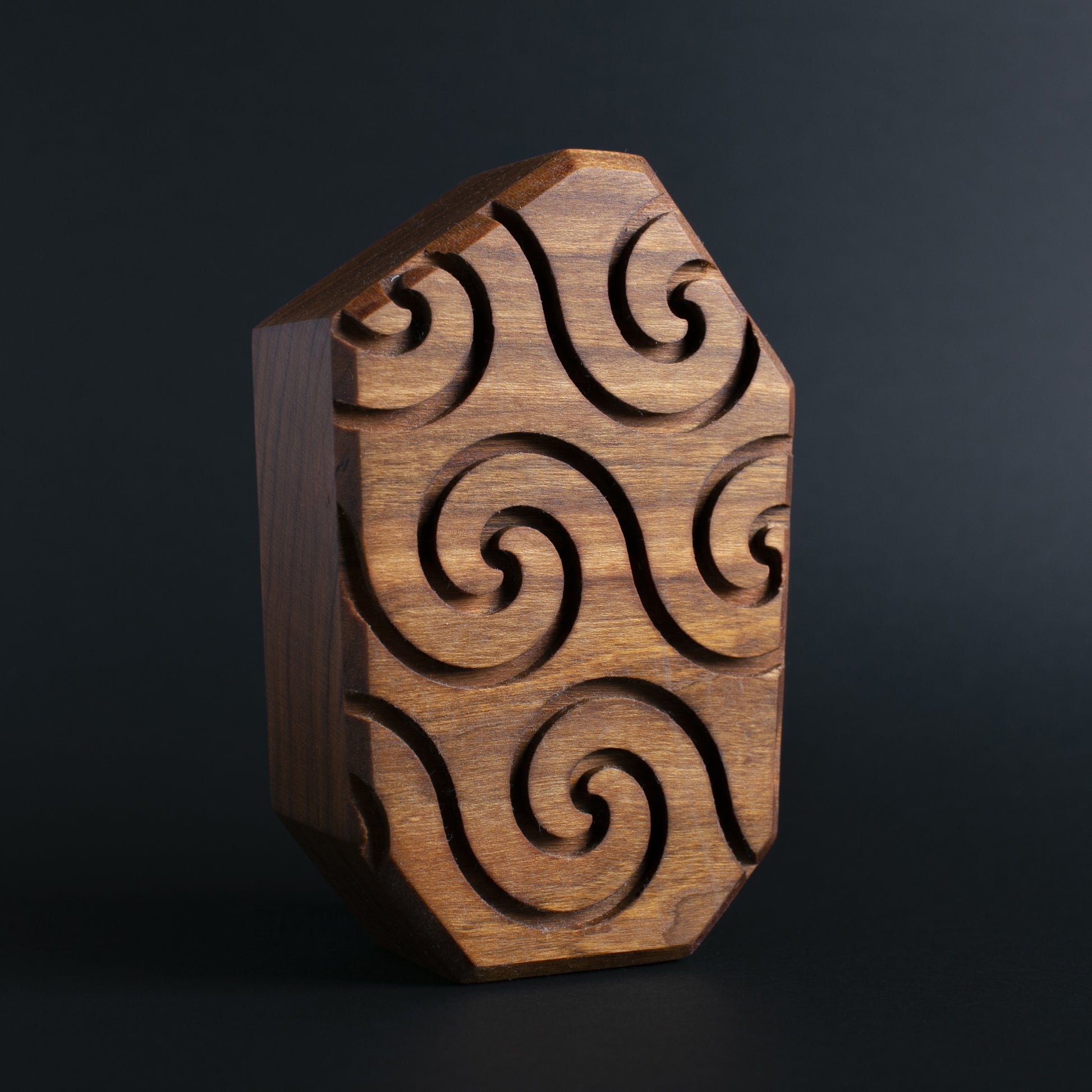 Glow-in-the-dark wooden talisman Buzznork offering protection and soothing light at night