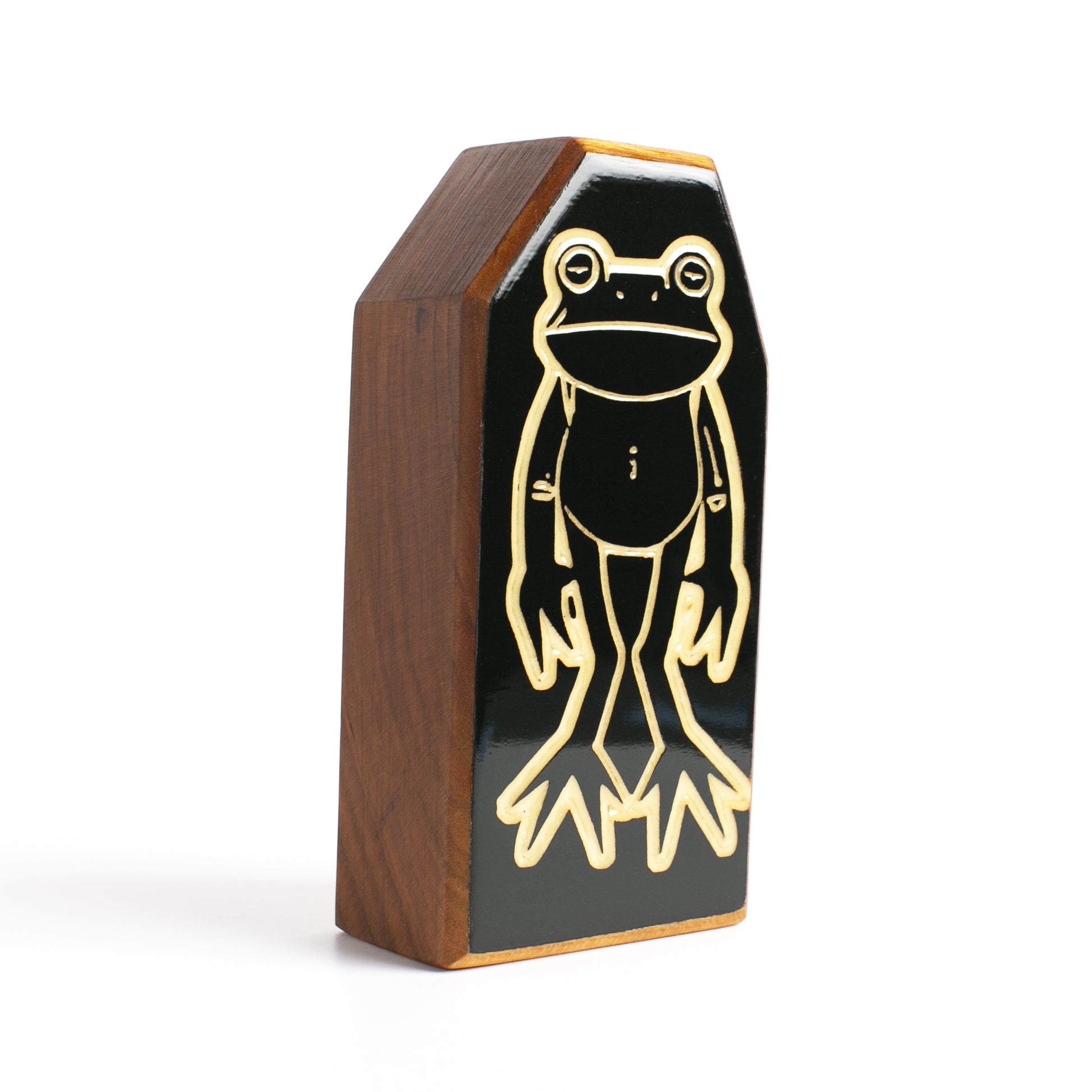 Floopfin handcrafted cherry wood talisman quarter side view with glow-in-the-dark accents.