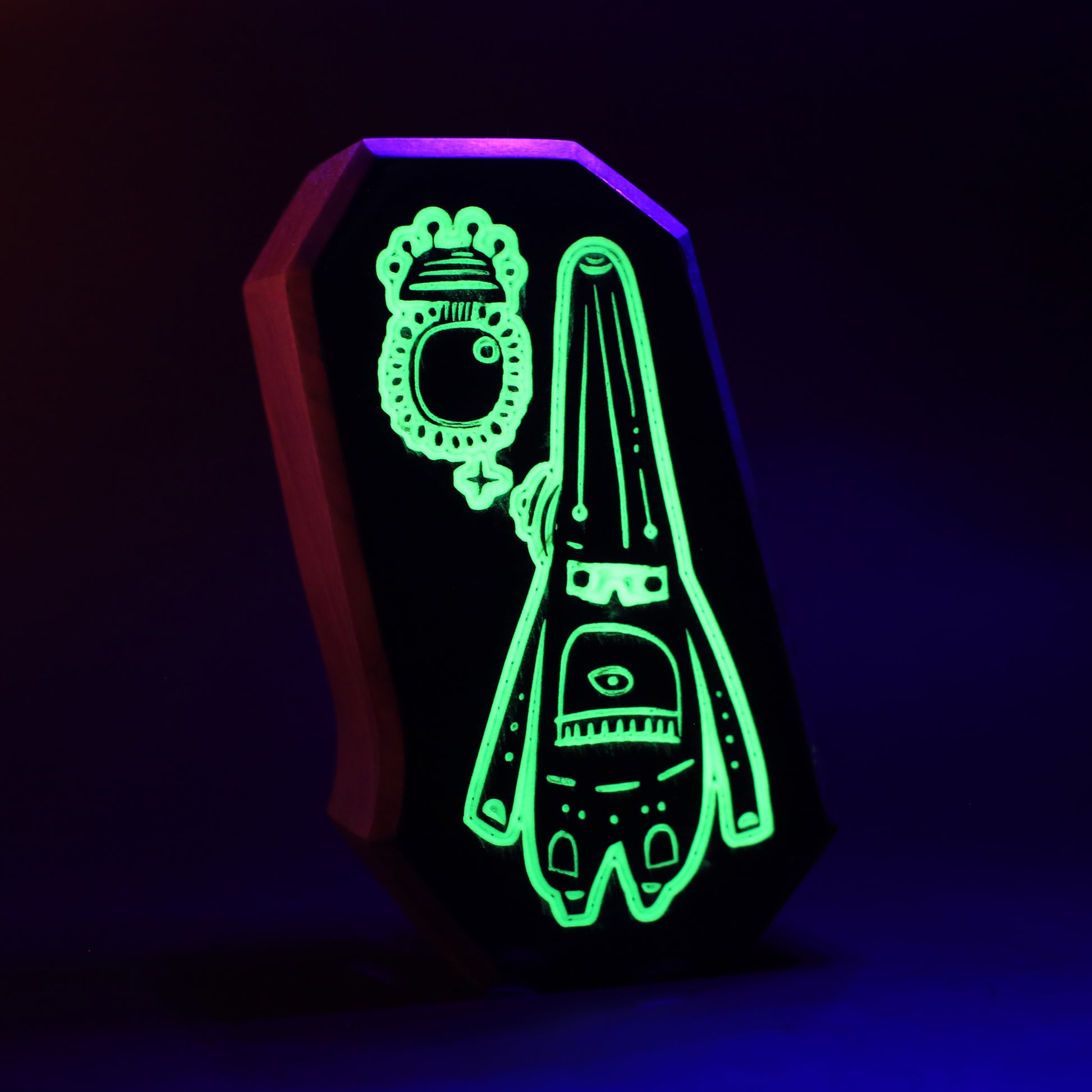 Glimbop and Quazglitz wooden charm glowing softly to protect children from bedtime fears