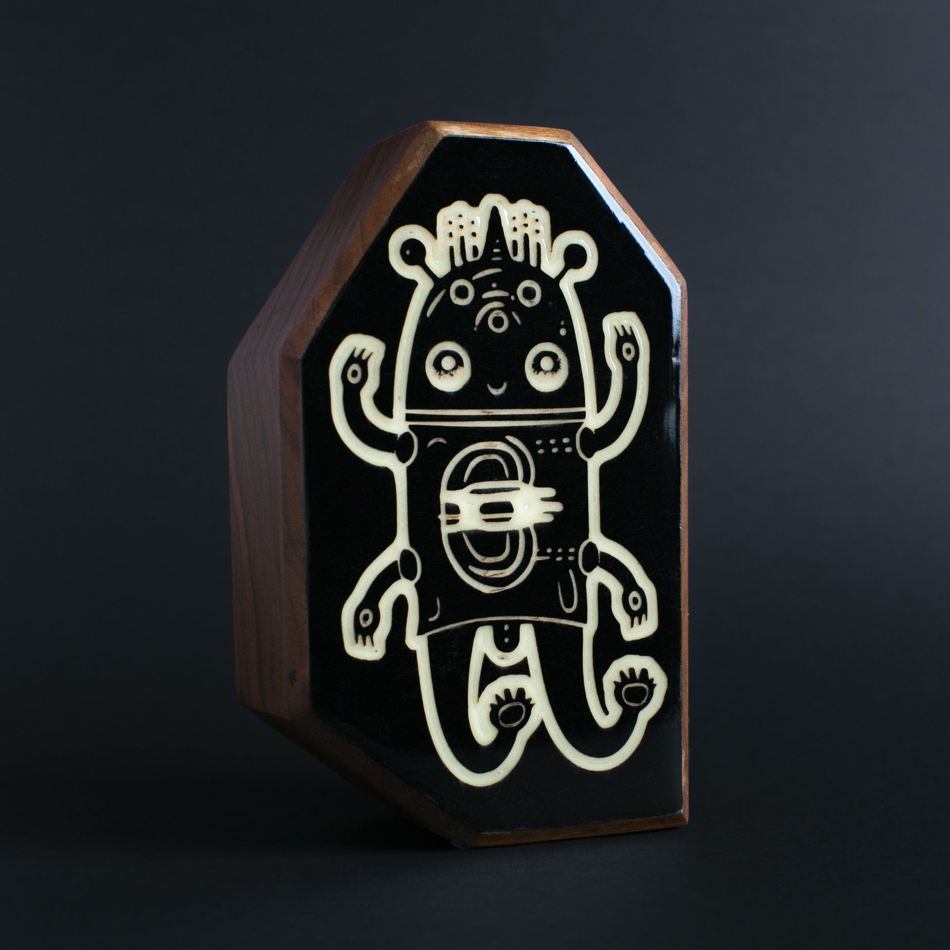 Cherry wood glow talisman featuring Glimborg the calming underwater protector