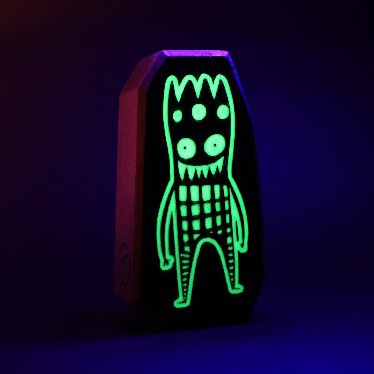 Glowbop wooden charm glowing softly to provide nighttime comfort for children