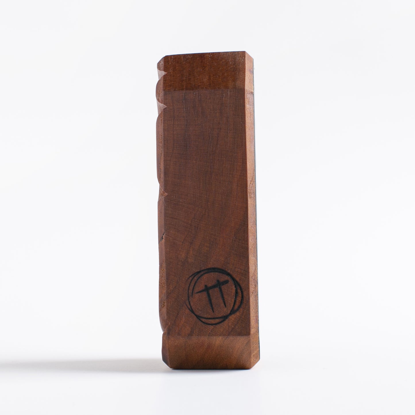 Handmade wooden talisman of Glowbop emitting a soothing glow at night