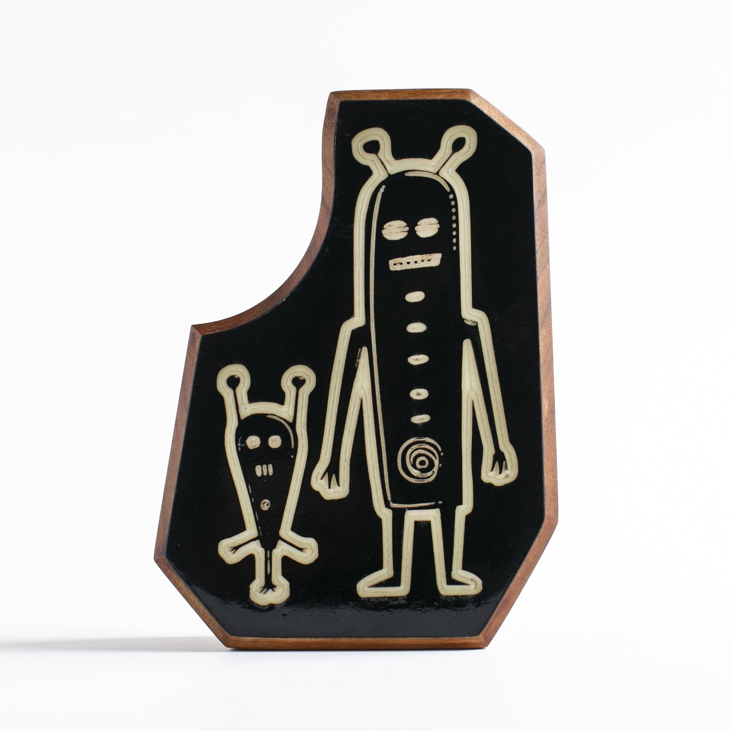Handcrafted glow-in-the-dark talisman featuring Nixblip and Blizmor the alien duo
