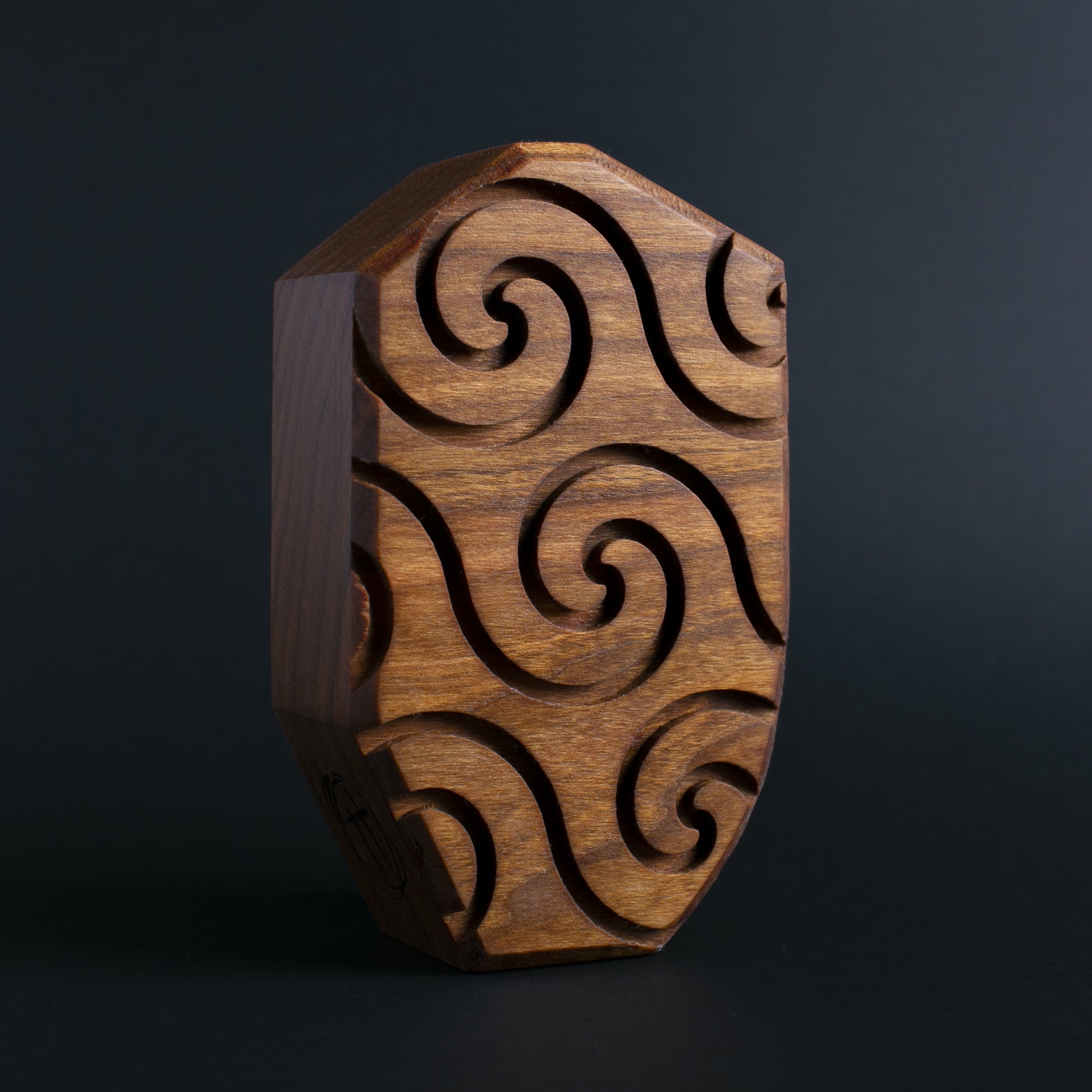 Glow-in-the-dark wooden talisman of Plazmorp offering protection through the night