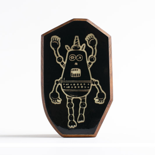Handcrafted glow-in-the-dark talisman featuring Plazmorp the time-traveling robot