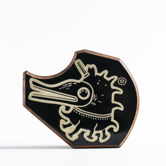 Handcrafted glow-in-the-dark talisman featuring Plonkzoid the ocean-dwelling guardian