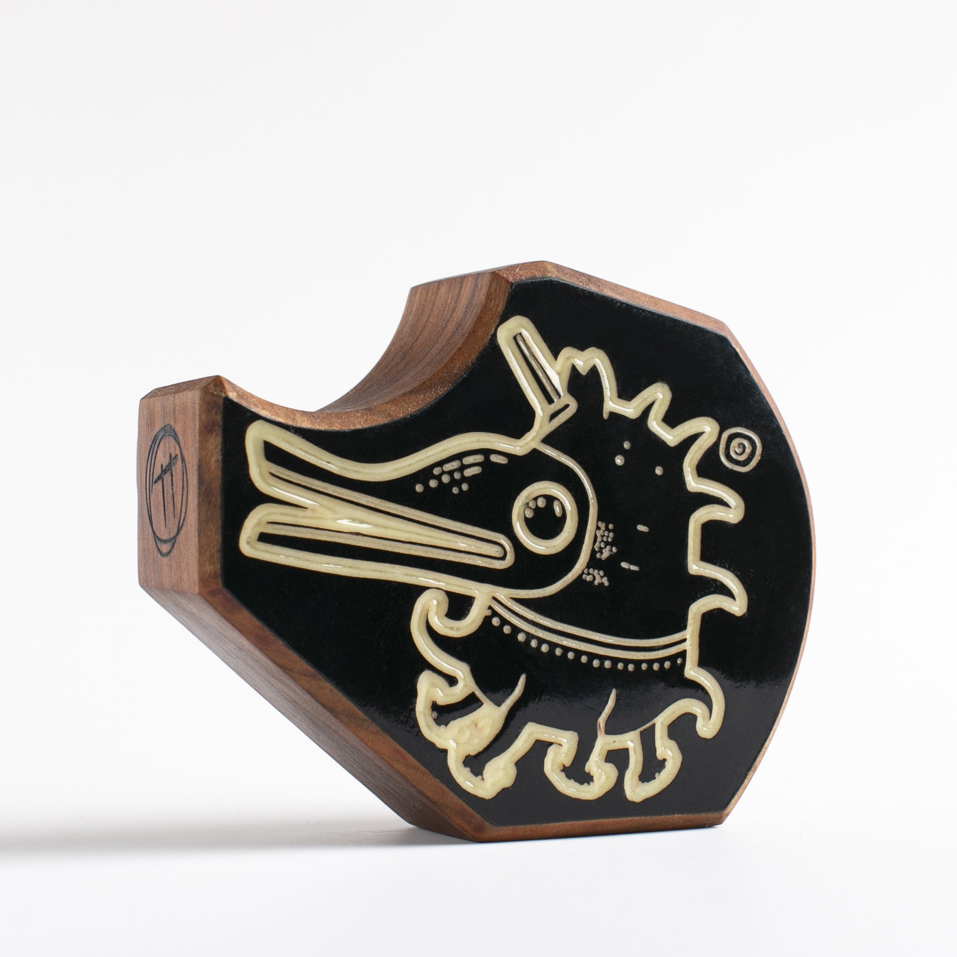 Cherry wood talisman with Plonkzoid design offering kids calming nighttime comfort