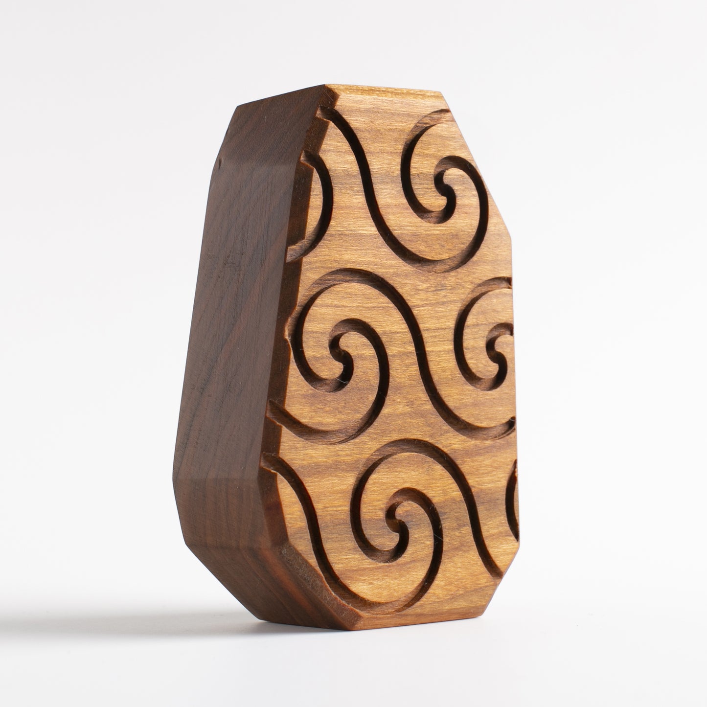 Handmade wooden talisman of Pyronoid with powerful arms and a radiant light