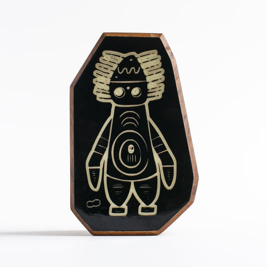Handcrafted glow-in-the-dark talisman featuring Pyronoid the high-tech mechanical guardian