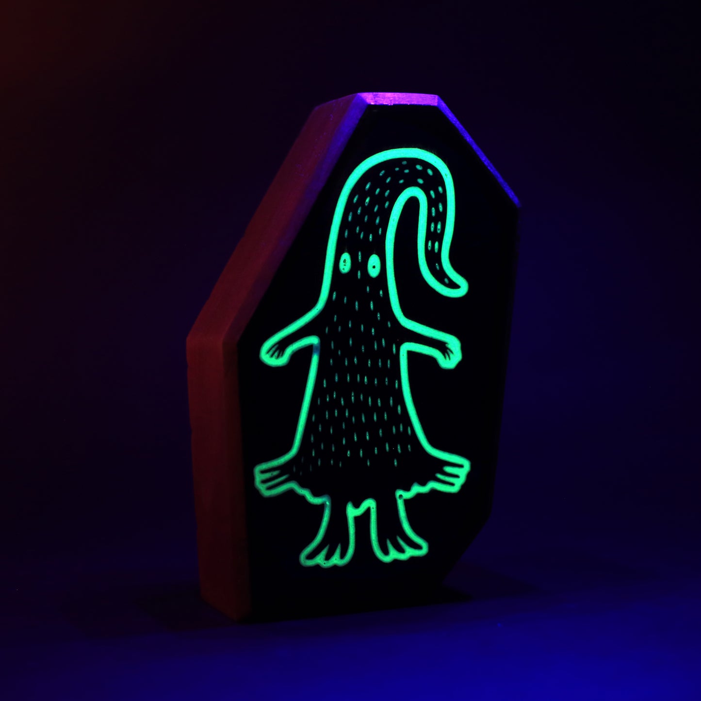 Quibblex wooden charm glowing softly to form a magical protective light barrier