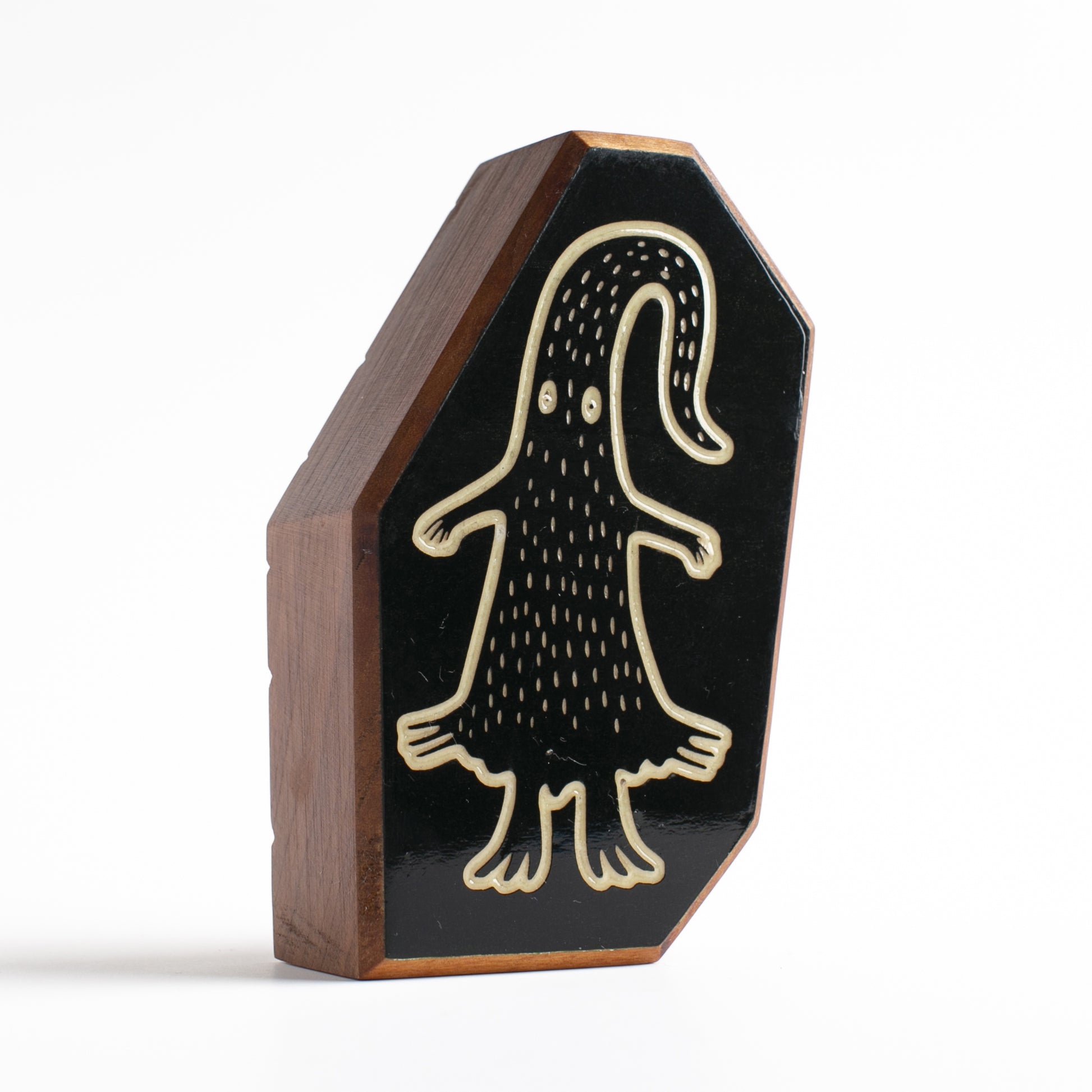 Cherry wood talisman with Quibblex design offering kids nighttime comfort and safety