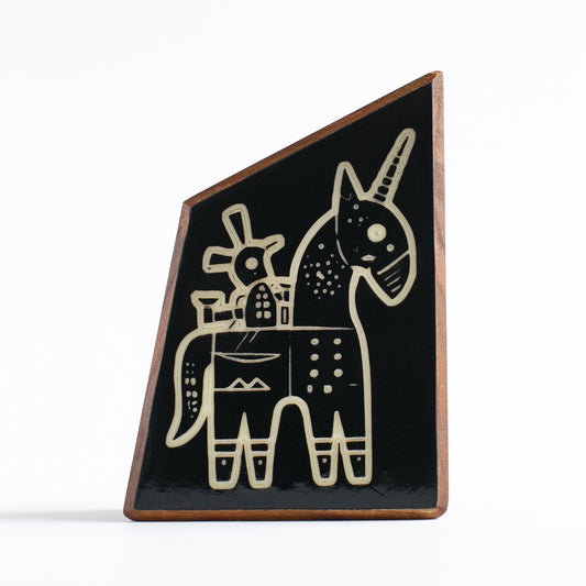 Handcrafted glow-in-the-dark talisman featuring Snazzle the whimsical unicorn