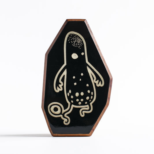 Handcrafted glow-in-the-dark talisman featuring Snorble the water-born alien