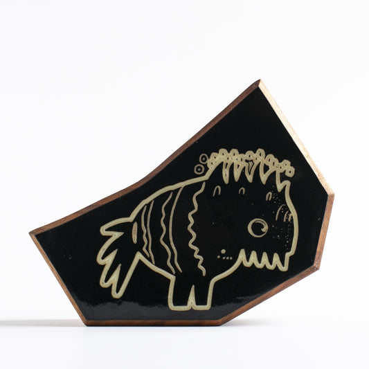 Handcrafted glow-in-the-dark talisman featuring Snorfblip the amphibious protector