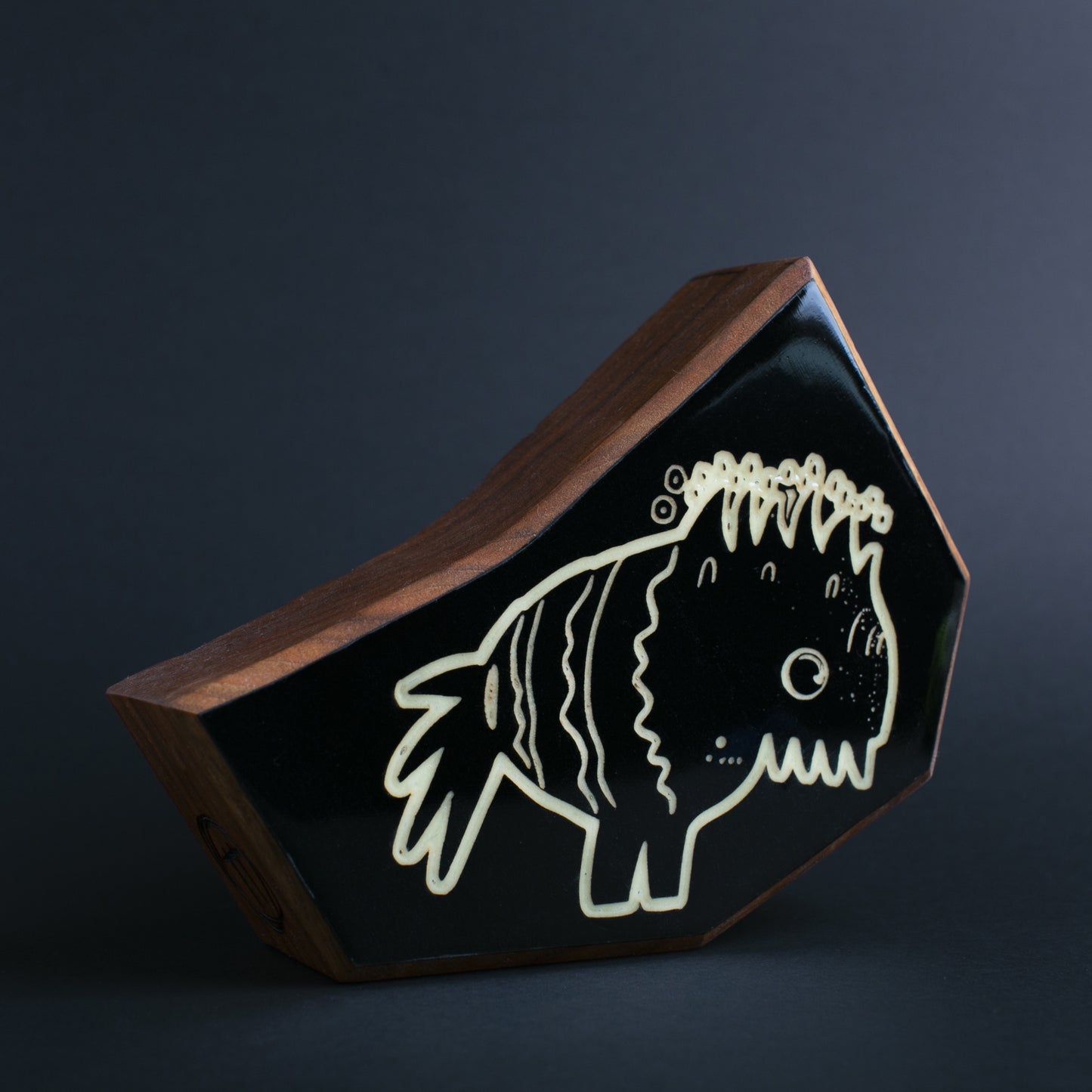 Cherry wood glow talisman featuring Snorfblip the dual-environment protector