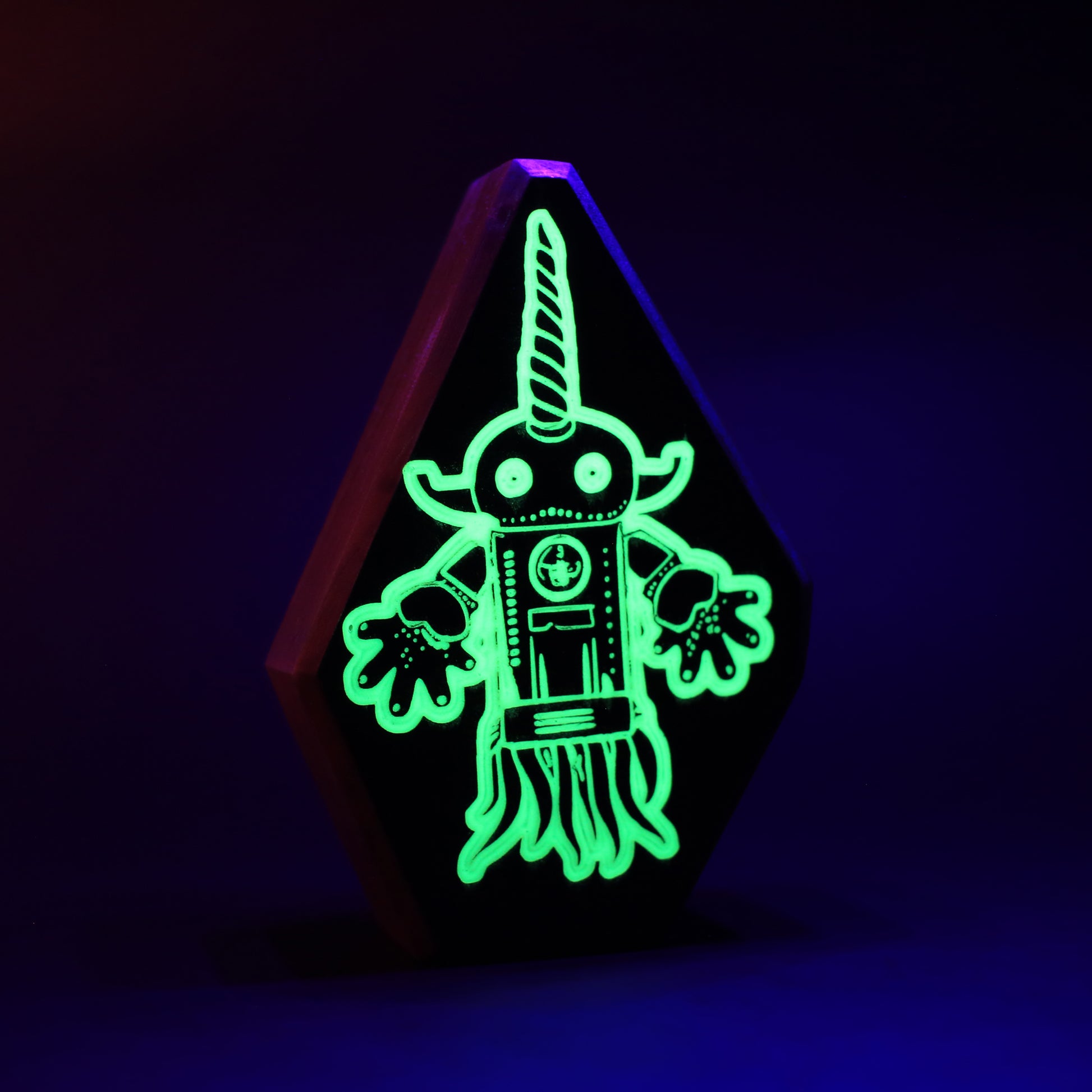 Squibnik wooden charm glowing softly to project holograms of brave warriors