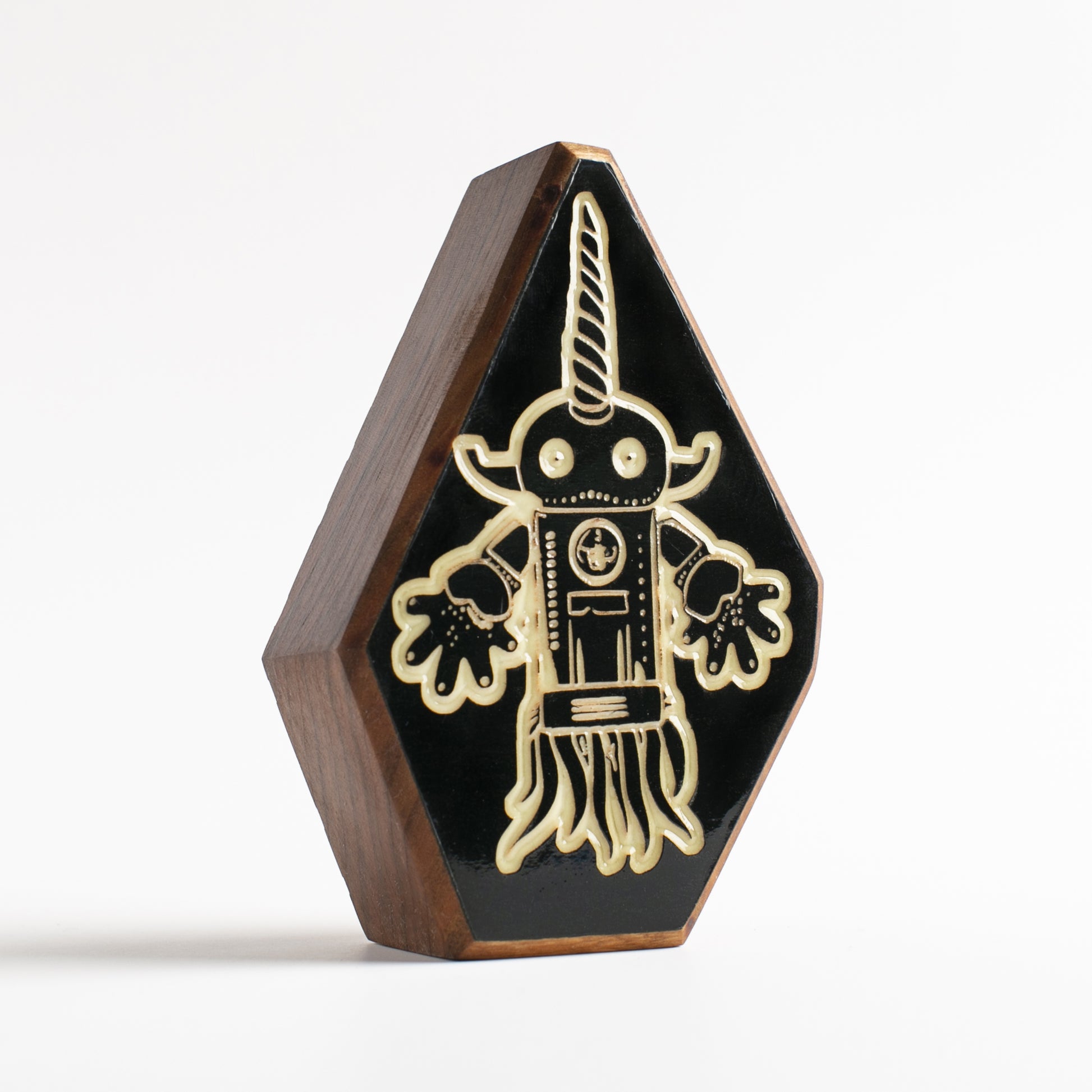 Cherry wood talisman with Squibnik design offering kids nighttime comfort and safety