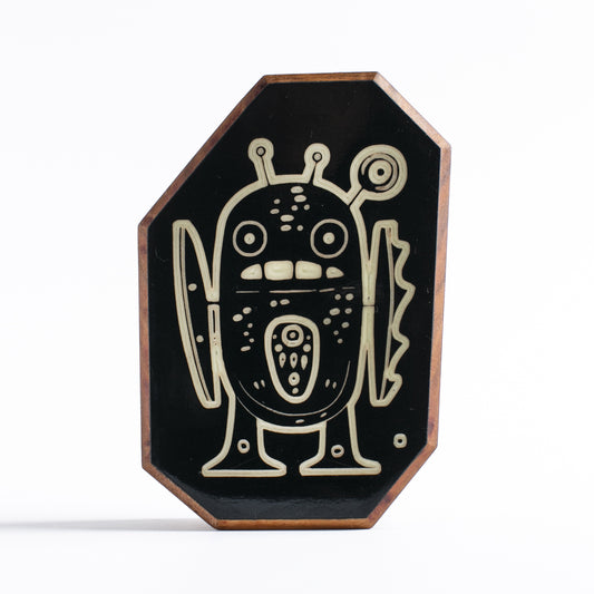 Handcrafted glow-in-the-dark talisman featuring Zorpwob the ancient warrior robot