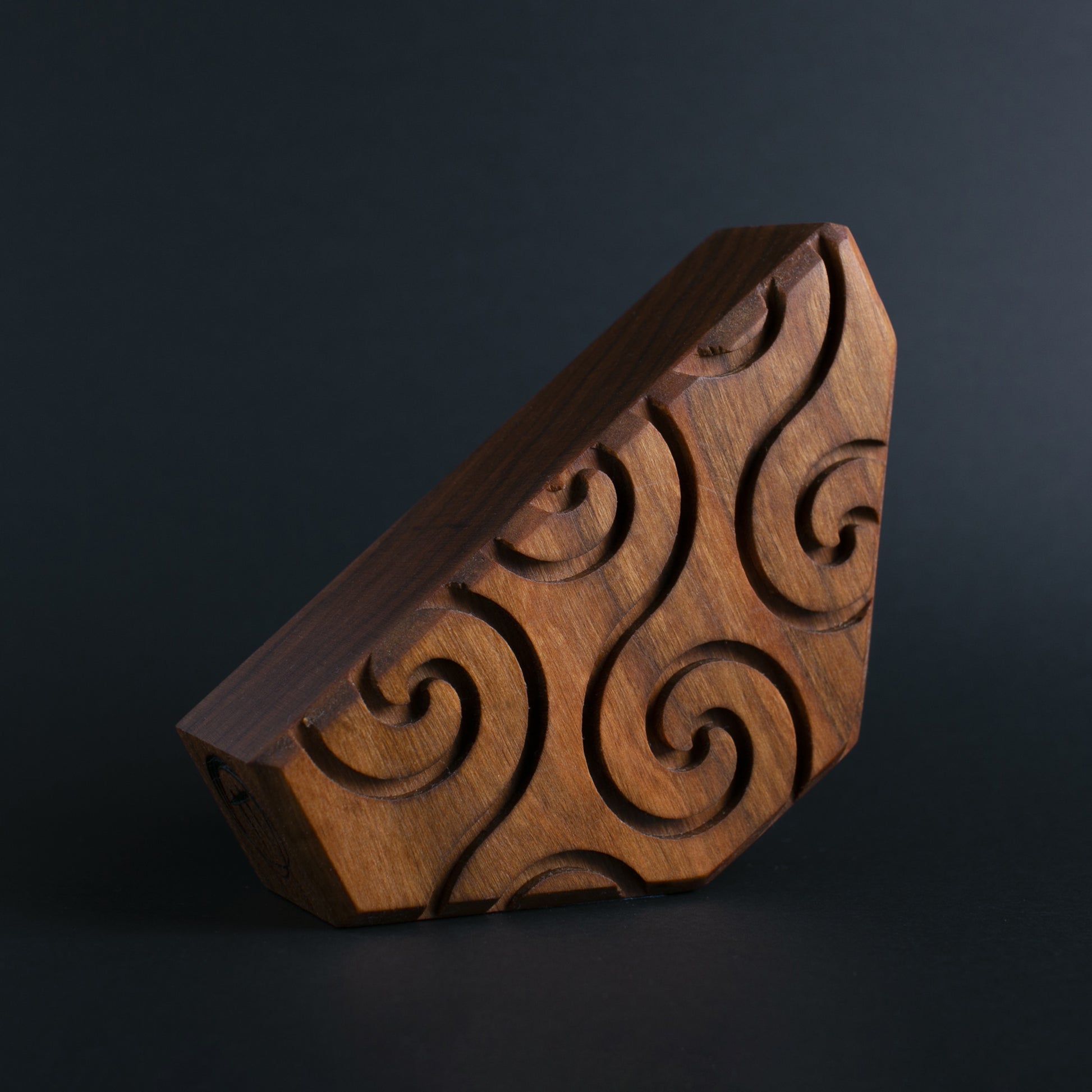 Glow-in-the-dark wooden talisman of Zyglot ensuring a secure and restful sleep