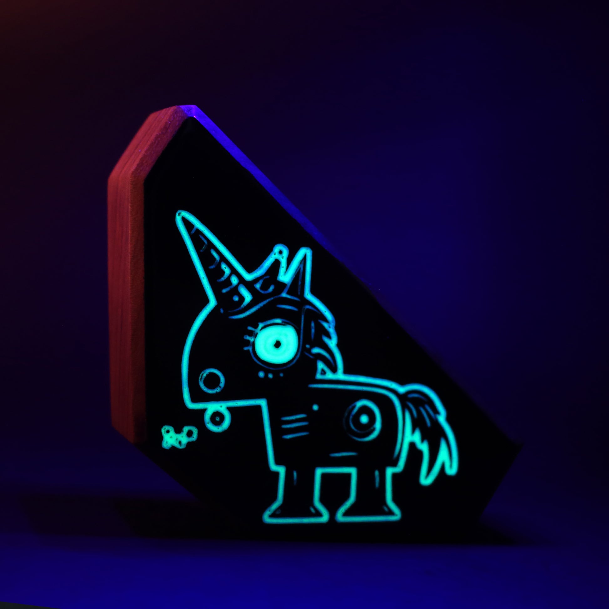 Zyglot wooden charm glowing softly to provide a comforting blue light at night