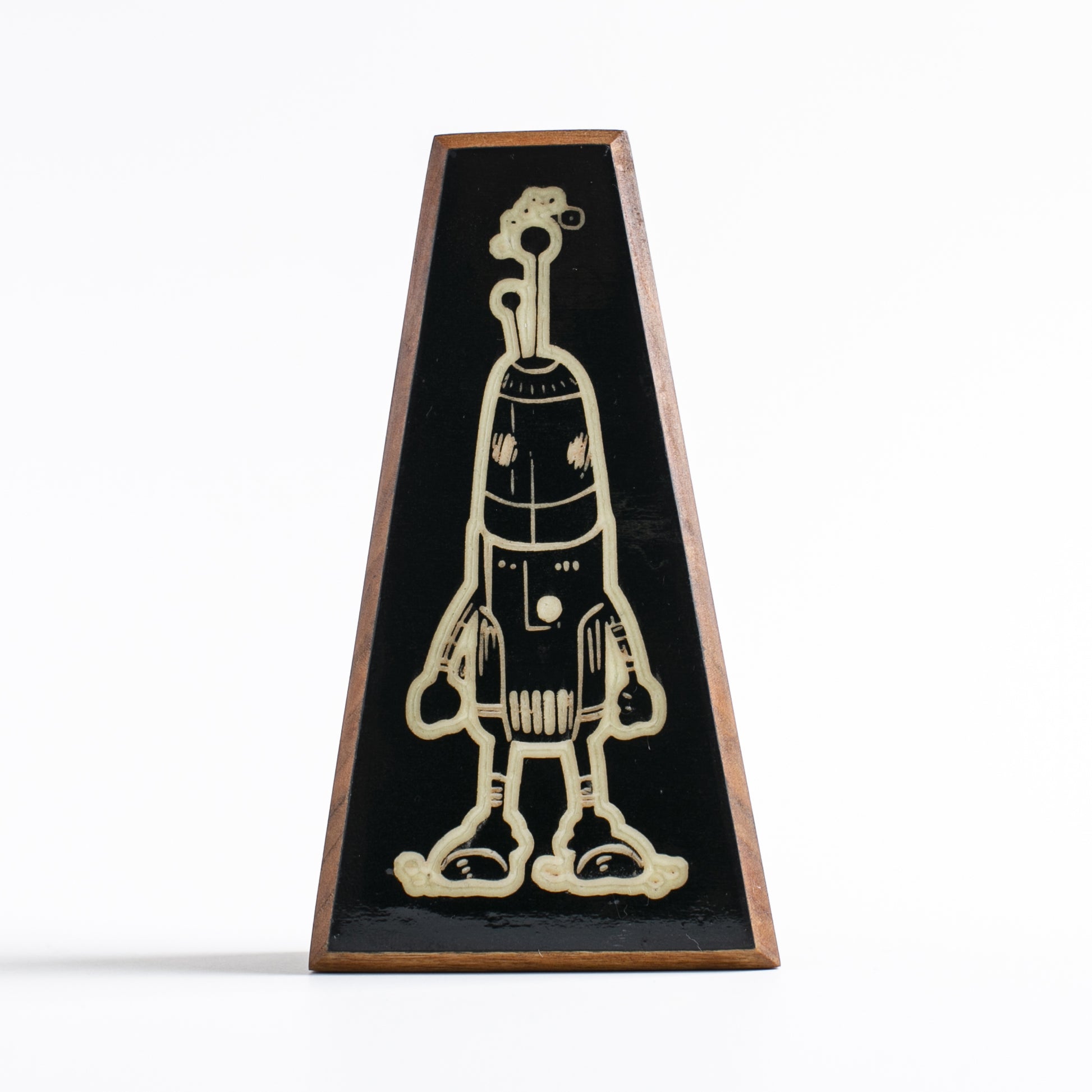 Handcrafted glow-in-the-dark talisman featuring Blizznook the robotic space traveler
