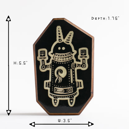 Cherry wood charm featuring Buzznork the robot, glowing softly for bedtime comfort
