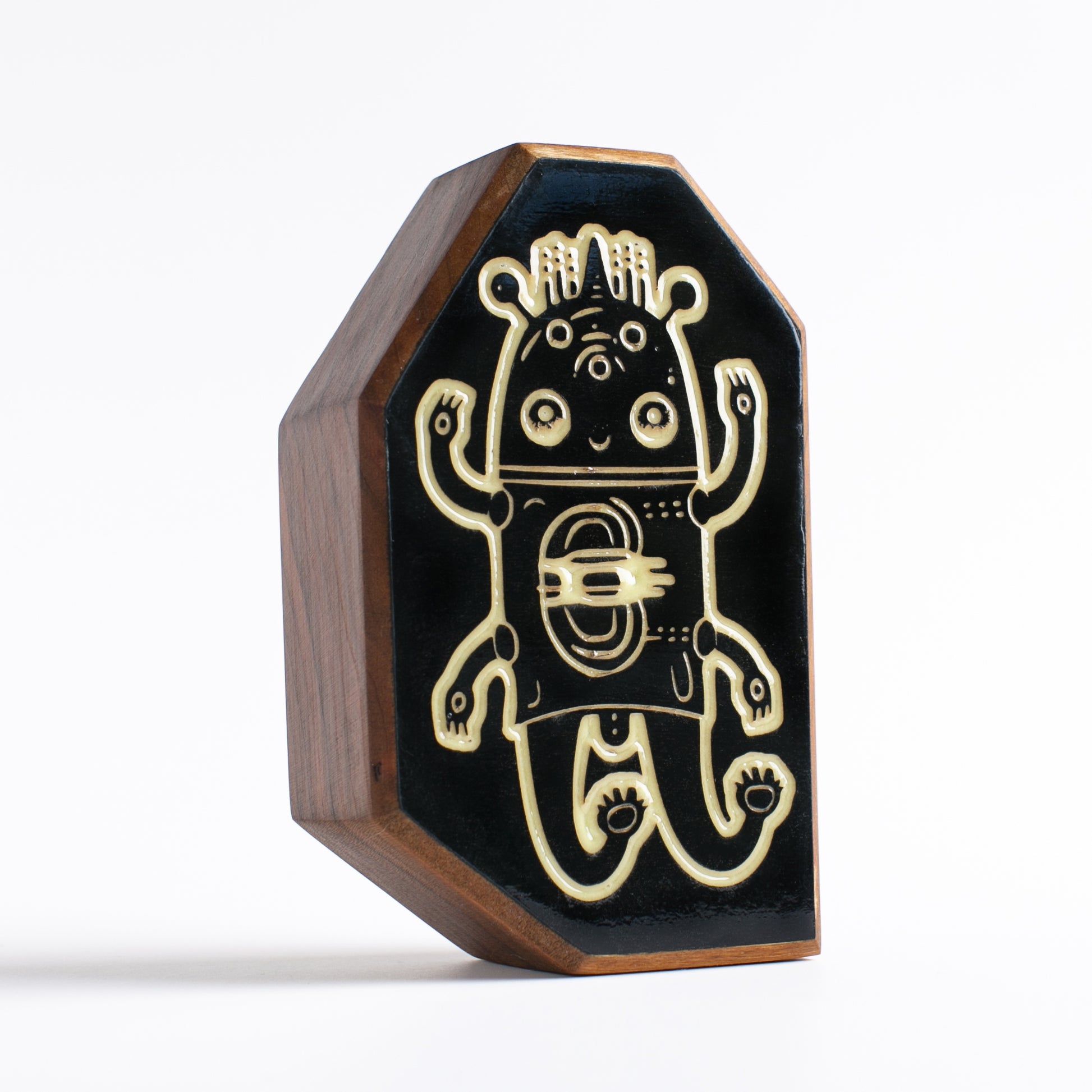 Cherry wood talisman with Glimborg design for kids’ bedtime reassurance
