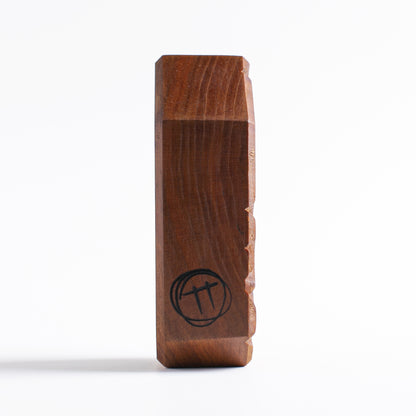 Handmade wooden talisman of Glintorb offering protection and calming sounds
