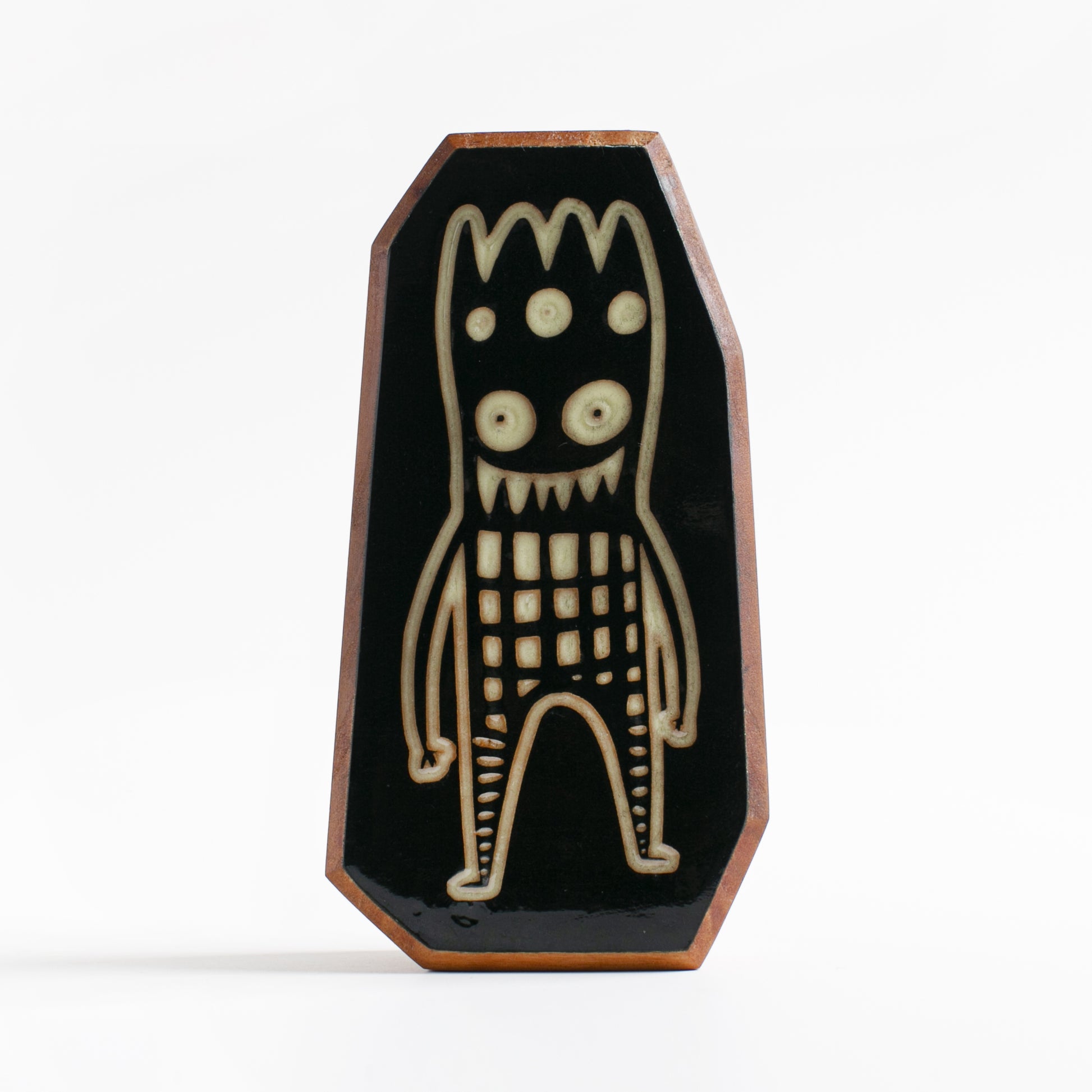 Handcrafted glow-in-the-dark talisman featuring Glowbop the calming tree spirit
