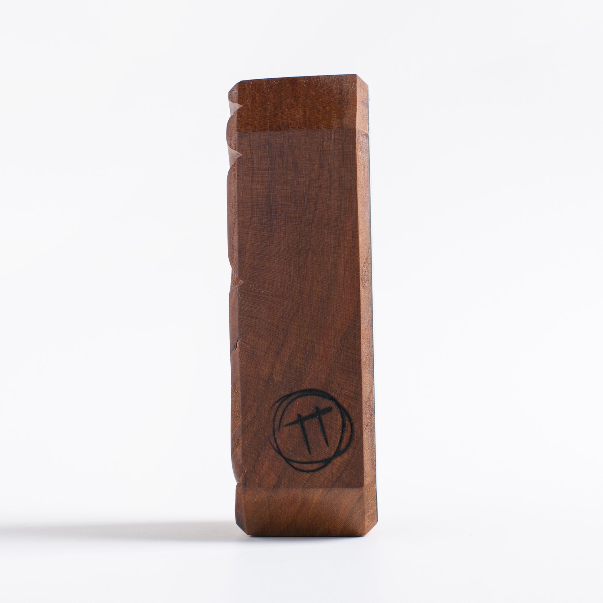 Handmade wooden talisman of Glowbop emitting a soothing glow at night

