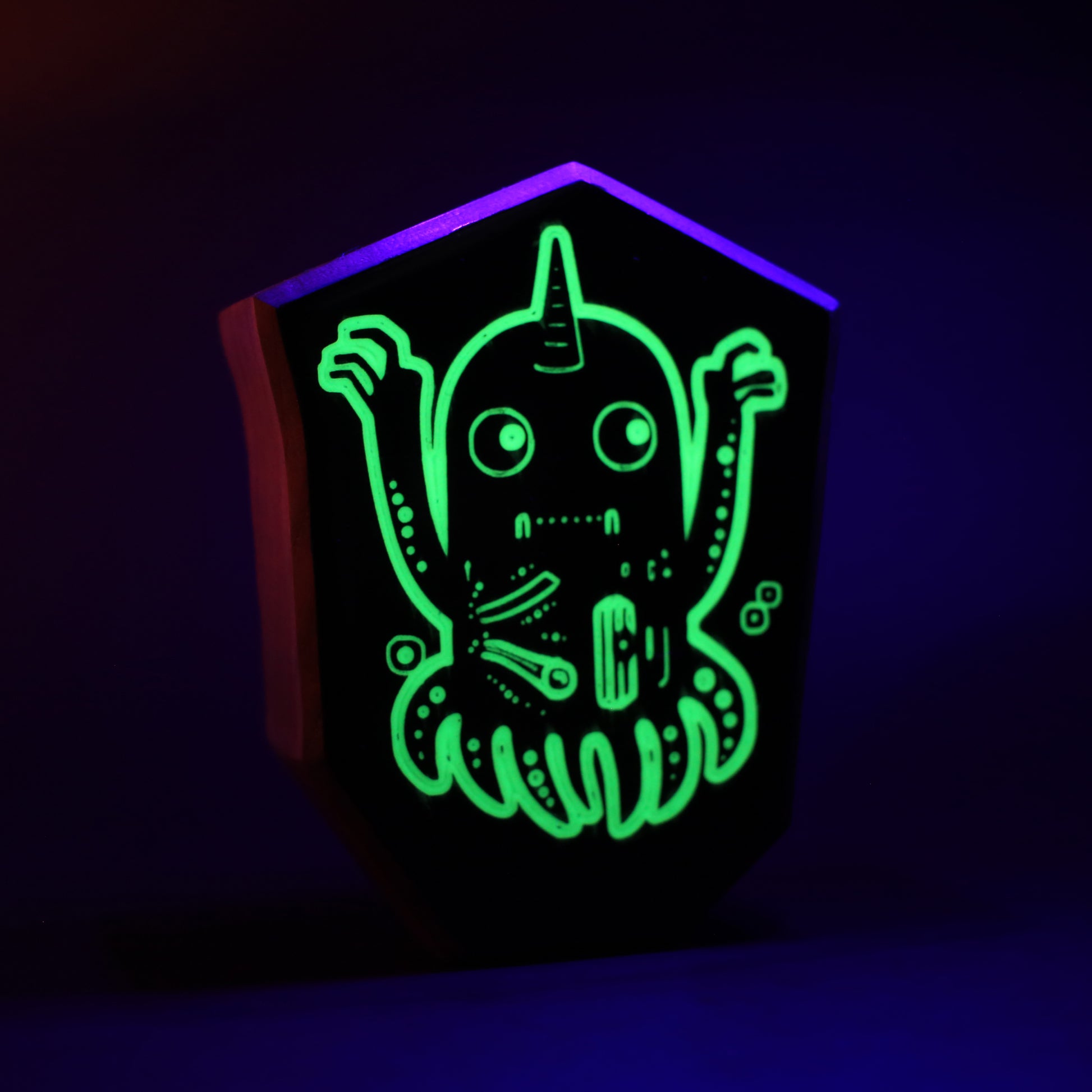 Jellywobble wooden charm glowing brightly to dazzle and confuse nighttime monsters
