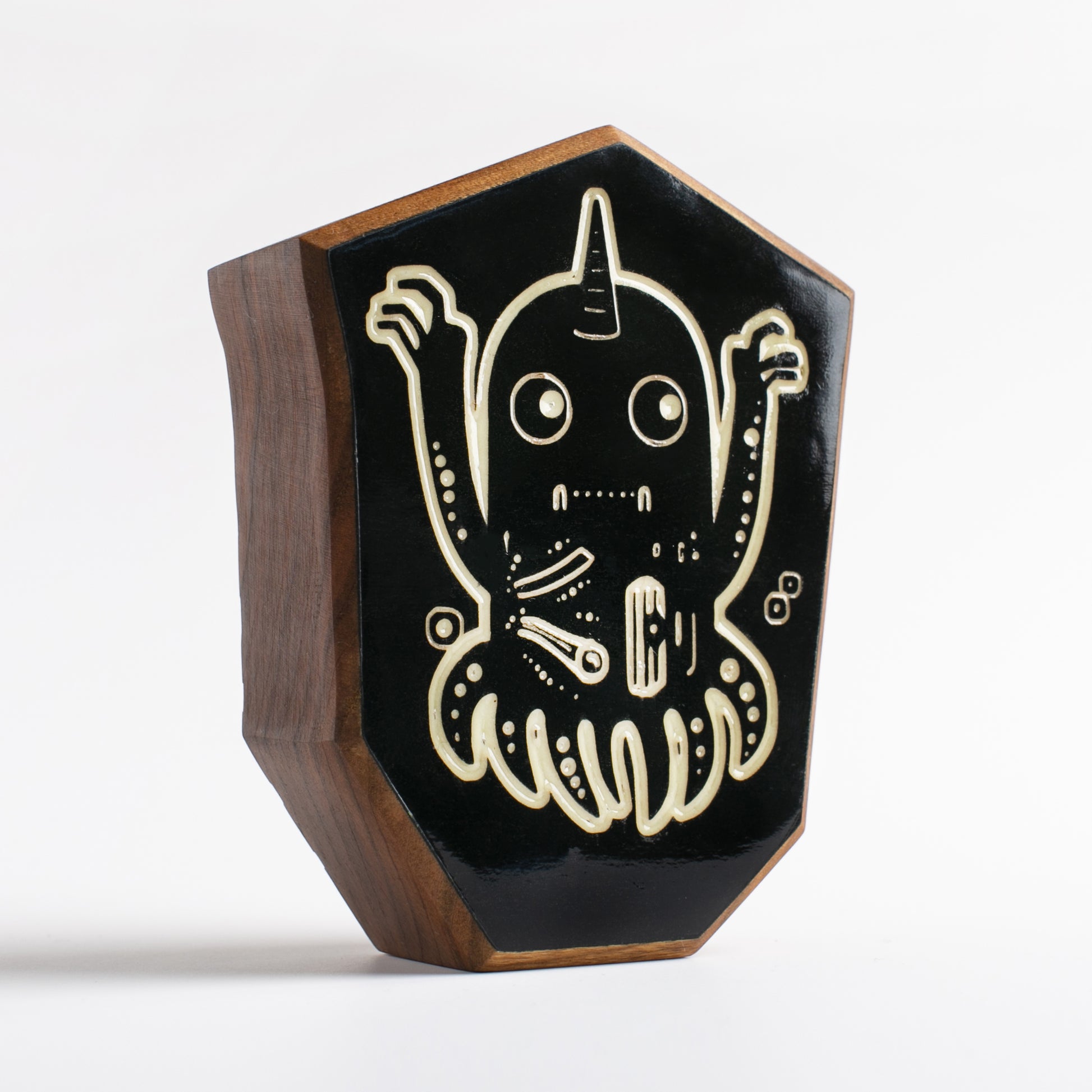 Cherry wood talisman with Jellywobble design providing bedtime comfort for kids

