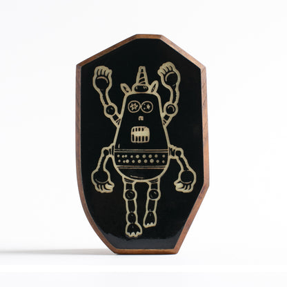 Handcrafted glow-in-the-dark talisman featuring Plazmorp the time-traveling robot
