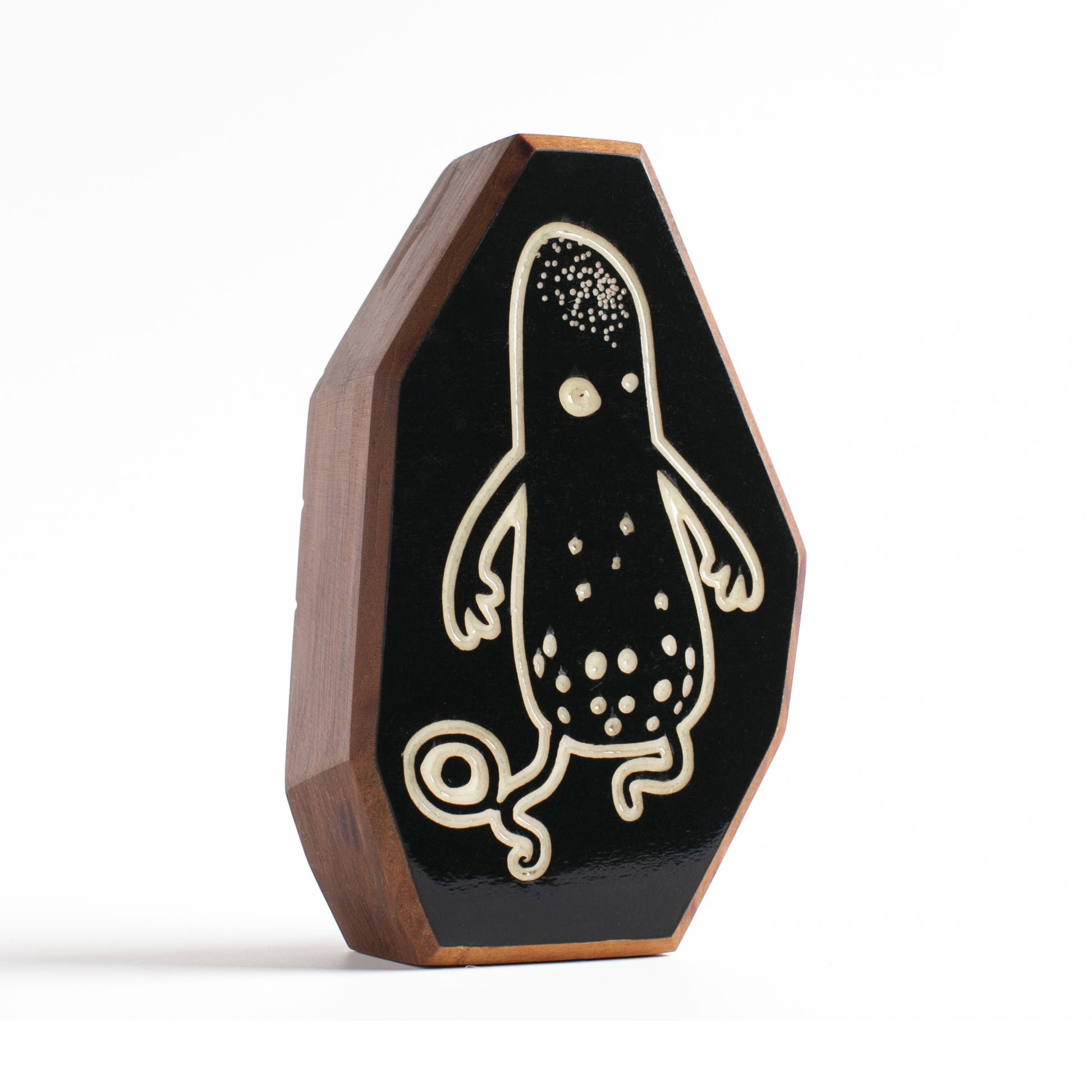 Cherry wood talisman with Snorble design offering kids bedtime comfort and safety
