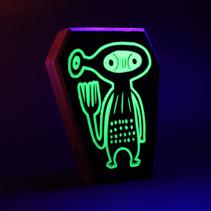 Xyloid wooden charm glowing softly to communicate with other guardians
