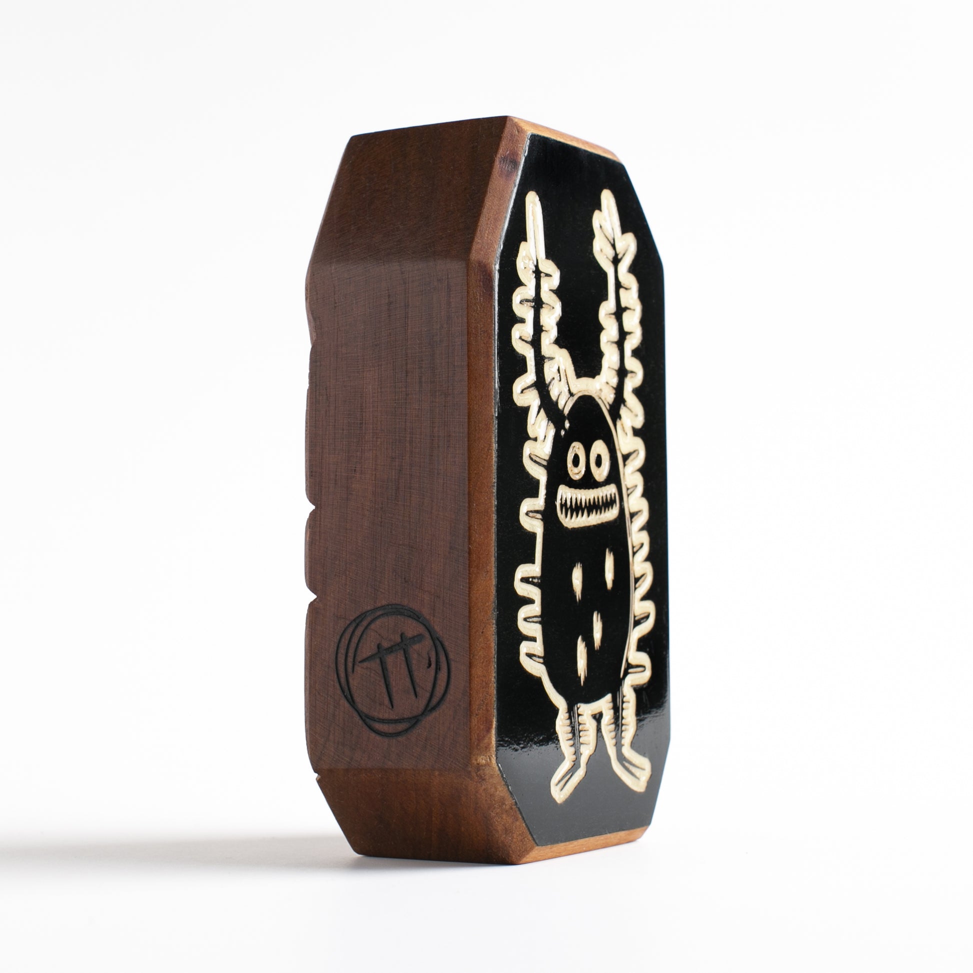 Cherry wood talisman with Zorplix design offering kids nighttime comfort and protection
