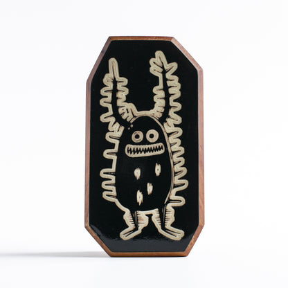 Handcrafted glow-in-the-dark talisman featuring Zorplix the fearless forest monster
