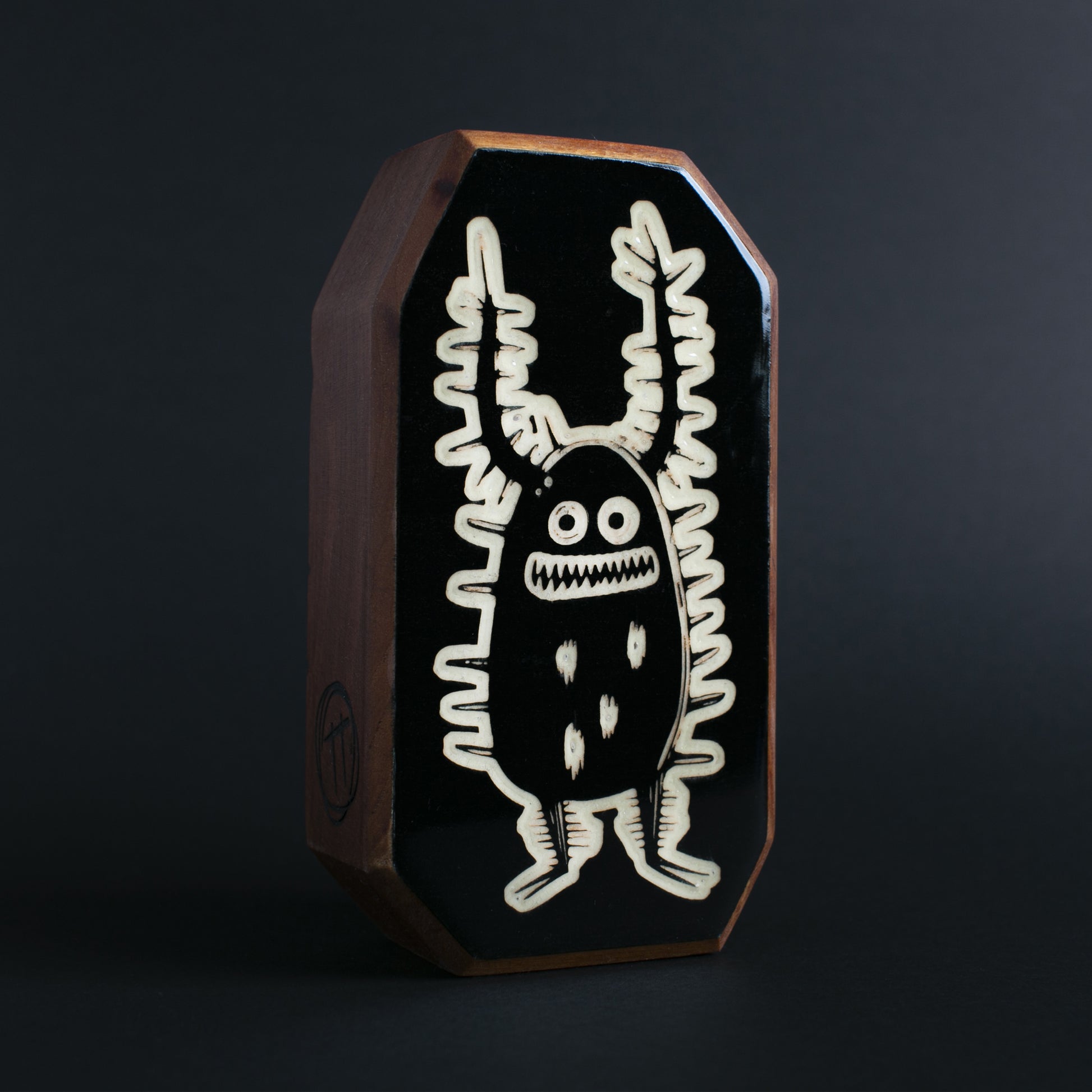 Cherry wood glow talisman featuring Zorplix the magical forest protector
