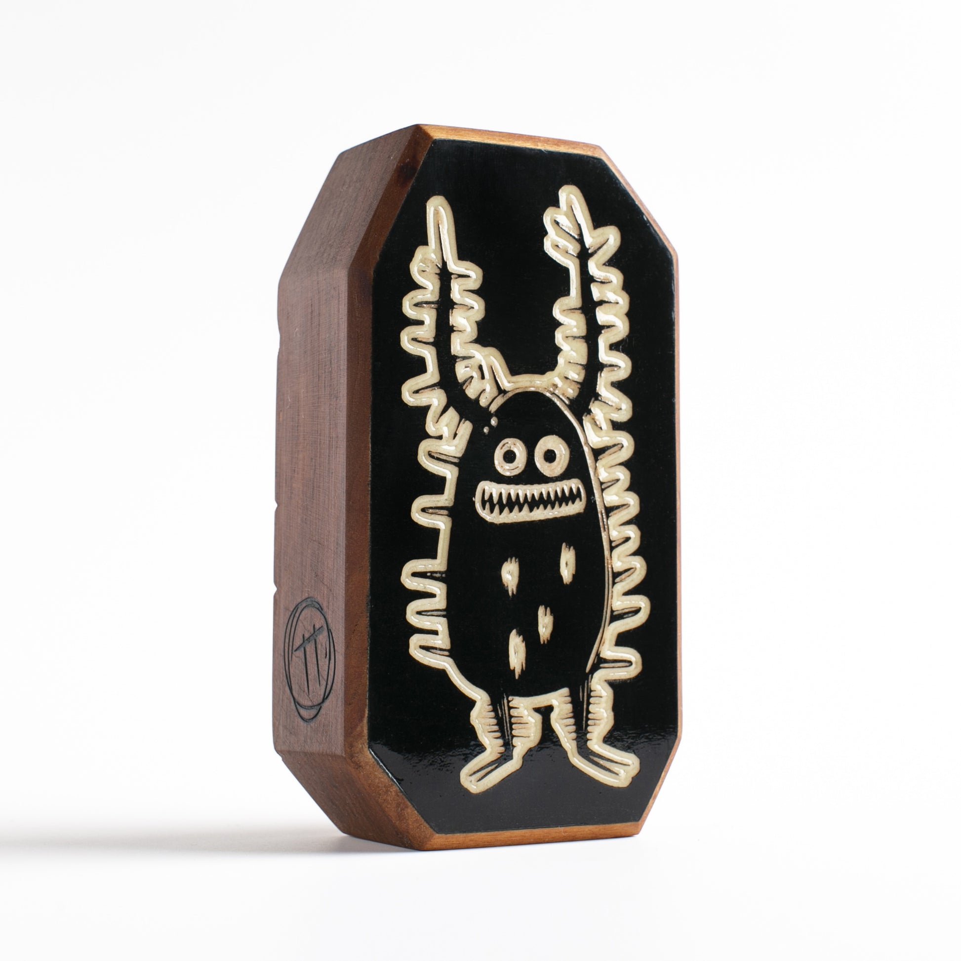 Cherry wood talisman with Zorplix design offering kids nighttime comfort and protection
