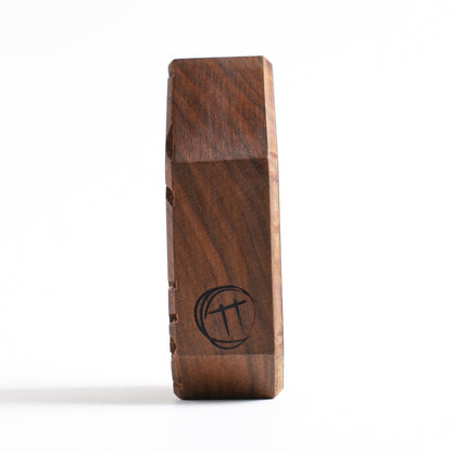 Handmade wooden talisman of Zorpwob providing a calming glow for peaceful sleep
