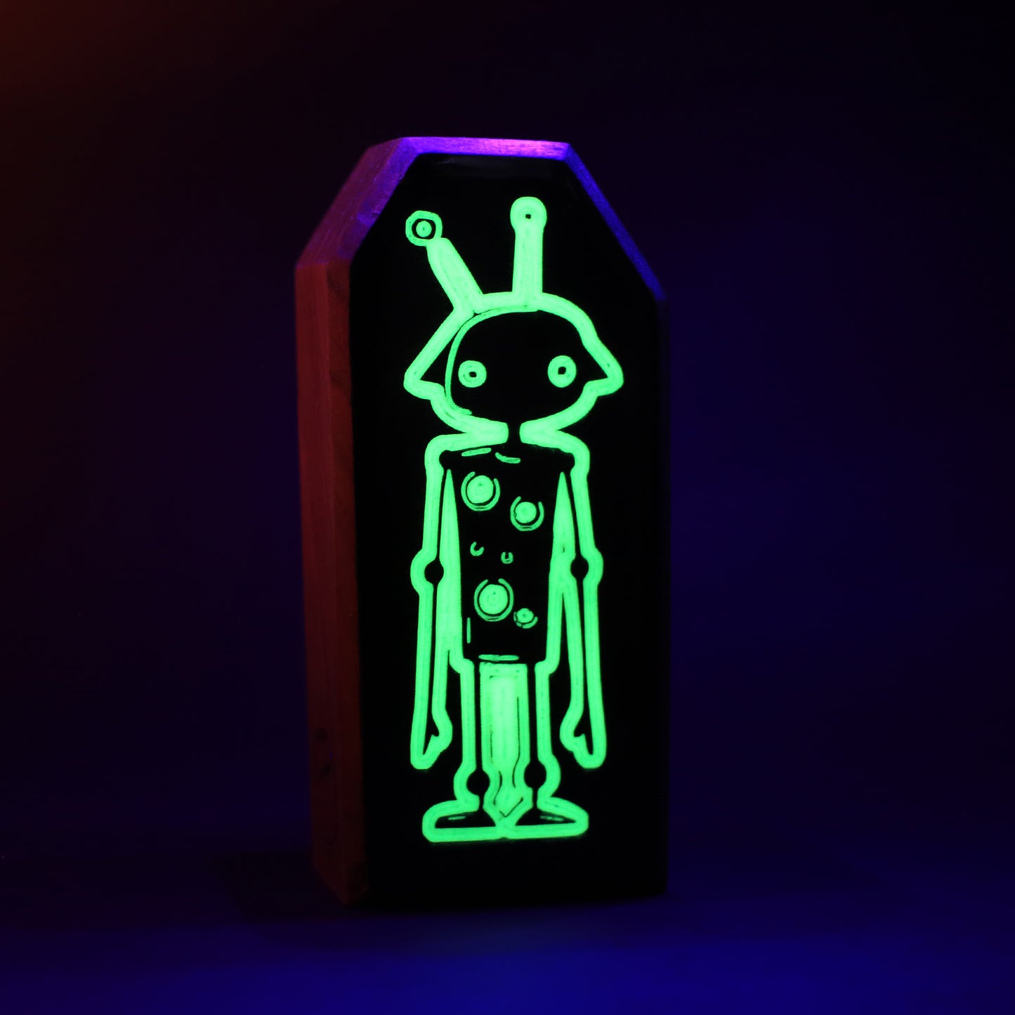 Zybotronk wooden charm glowing softly to reflect monster images back and scare them away
