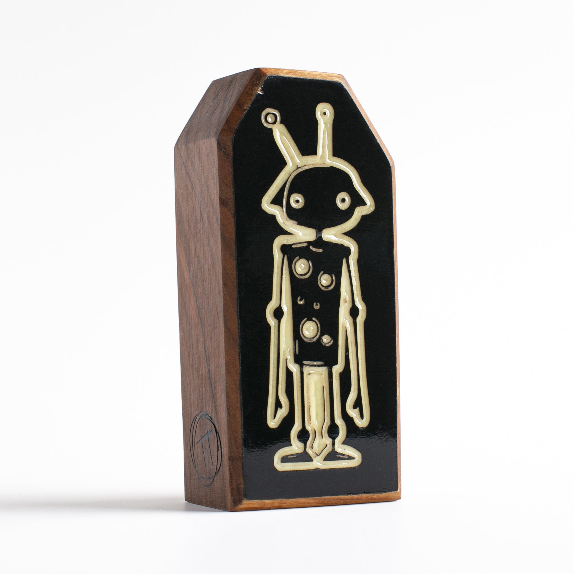 Cherry wood talisman with Zybotronk design offering kids nighttime comfort and protection
