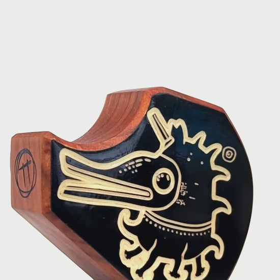Wooden guardian Plonkzoid glowing brightly to keep bedtime fears away
