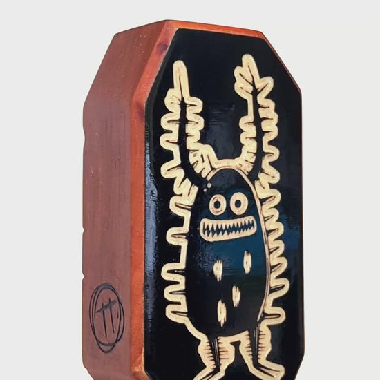 Zorplix glow-in-the-dark charm crafted to ward off monsters with its glowing antennae
