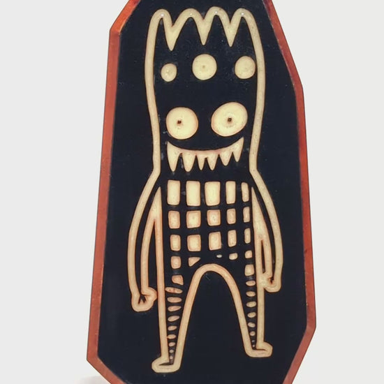 Wooden guardian Glowbop glowing softly to protect children from nighttime fears
