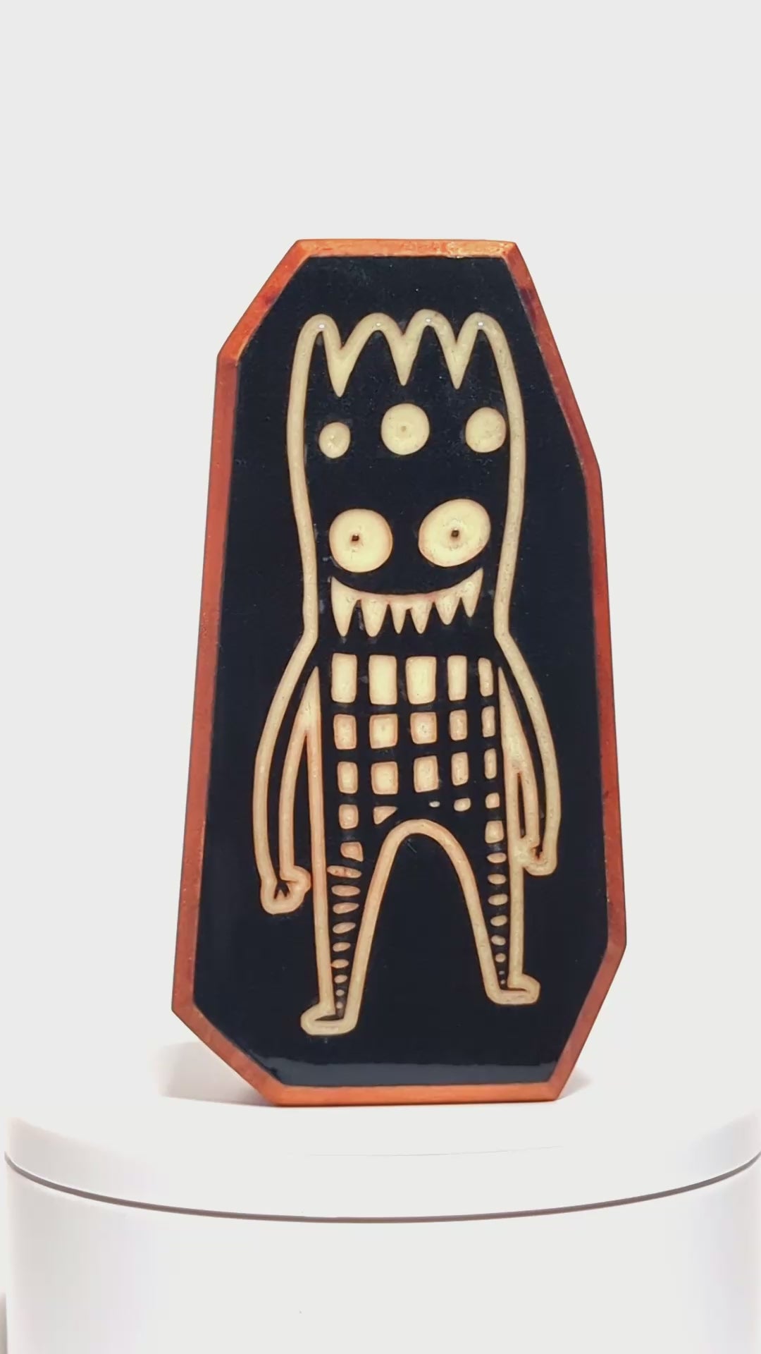 Wooden guardian Glowbop glowing softly to protect children from nighttime fears
