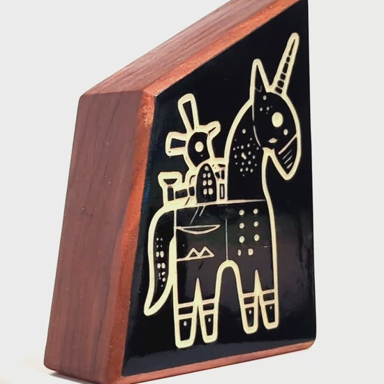 Wooden guardian Snazzle glowing brightly to shield children from shadows
