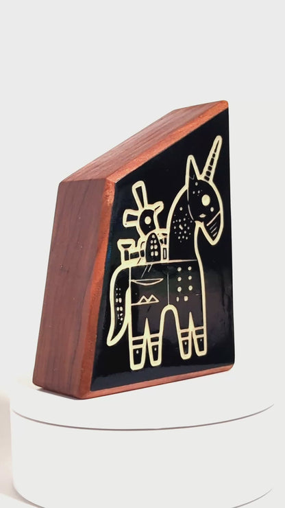 Wooden guardian Snazzle glowing brightly to shield children from shadows
