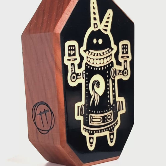 Glow-in-the-dark talisman Buzznork designed to protect kids from shadows and monsters
